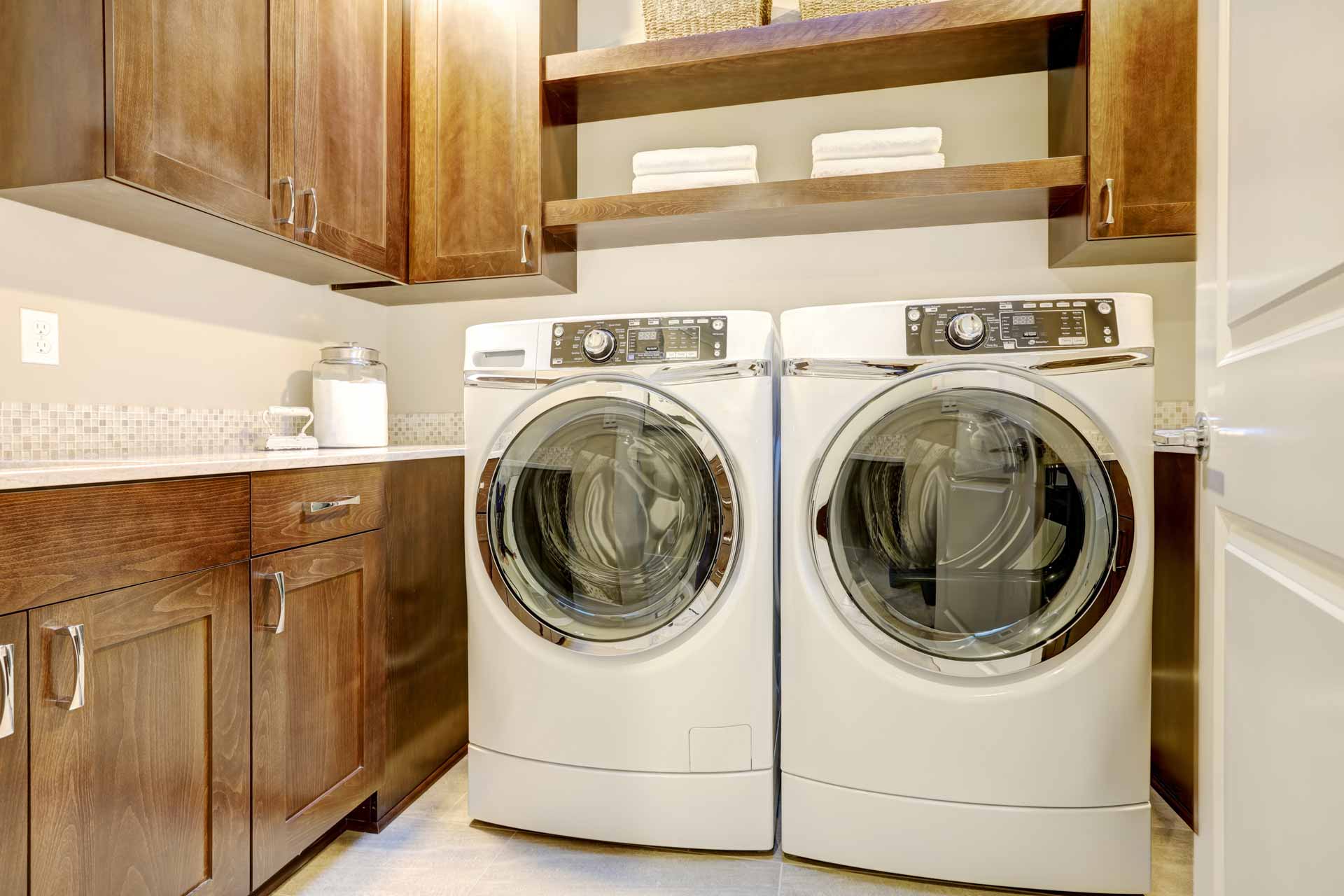 Washer and dryer side-by-side in laundry room